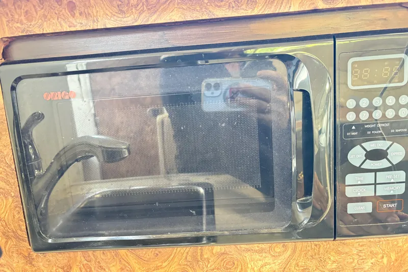 Slide: The Image of Built-in microwave in 2003 Bayliner 285 Ciera boat kitchen area. - 17