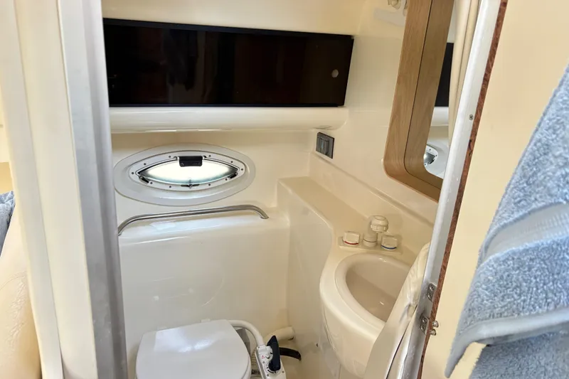 Slide: The Image of Bathroom interior of 2003 Bayliner 285 Ciera boat with sink and toilet. - 22