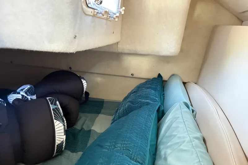 Slide: The Image of Interior cabin of 2003 Bayliner 285 Ciera with cozy bedding and pillows. - 24