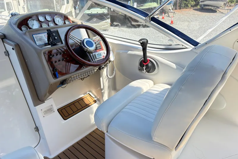 Slide: The Image of 2003 Bayliner 285 Ciera helm with steering wheel and control panel. - 6
