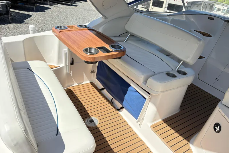 Slide: The Image of Interior of 2003 Bayliner 285 Ciera boat with seating and wooden table. - 8