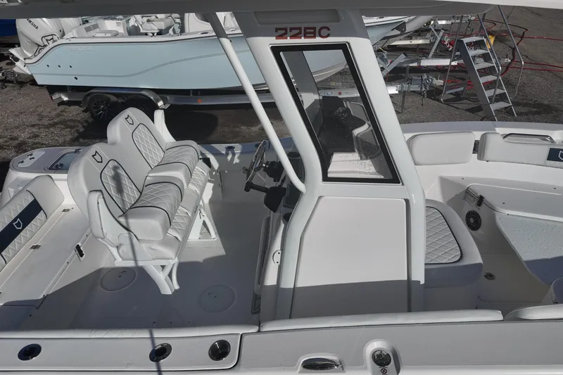 Slide: The Image of 2026 Sea Fox 228 Commander boat interior with seating and steering console. - 14