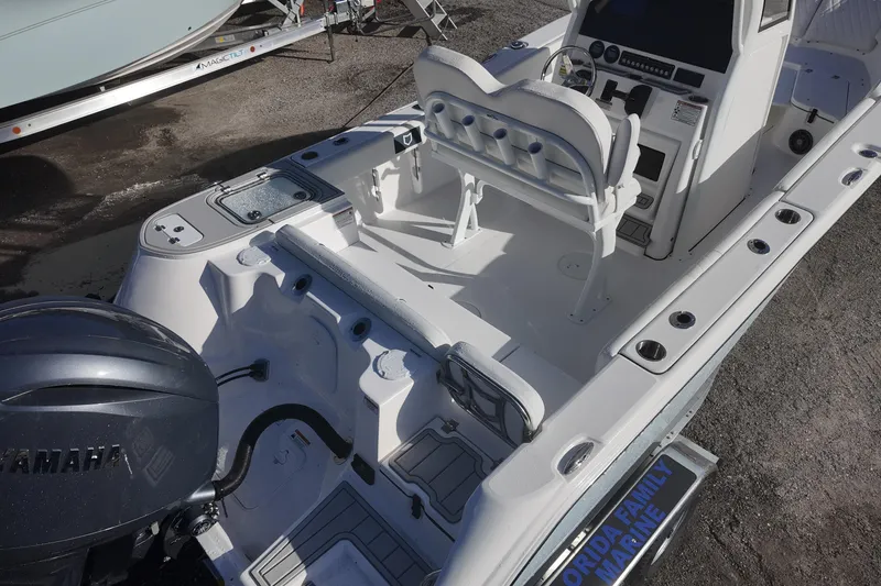 Slide: The Image of 2026 Sea Fox 228 Commander boat interior with Yamaha engine, featuring seating and control console. - 3