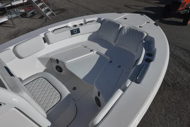 Slide: The Image of 2026 Sea Fox 228 Commander boat interior with cushioned seating and storage compartments. - 6