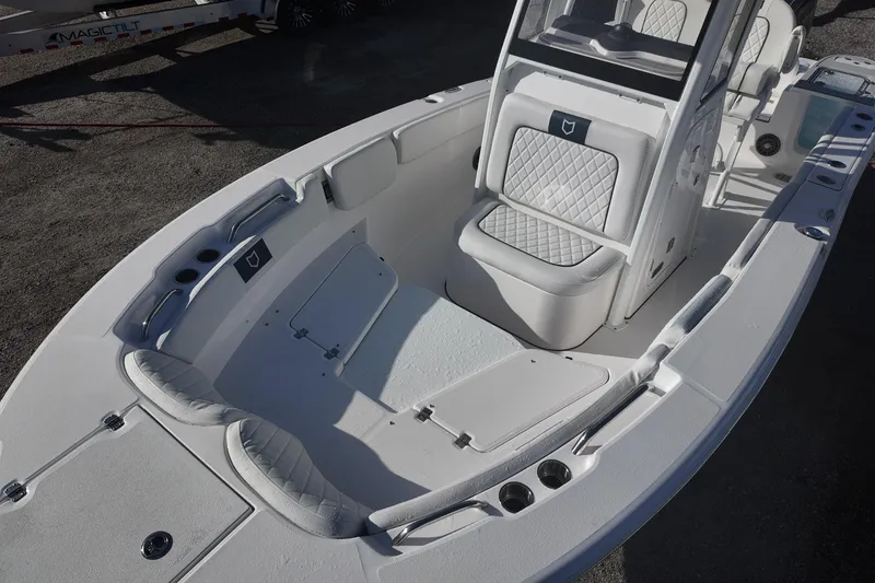 Slide: The Image of 2026 Sea Fox 228 Commander boat interior with cushioned seating and storage compartments. - 8