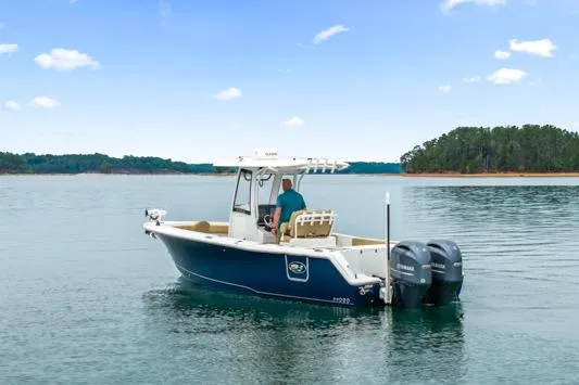 The Image of 2018 Sea Hunt Gamefish 27 boat on calm water with dual engines. - 0
