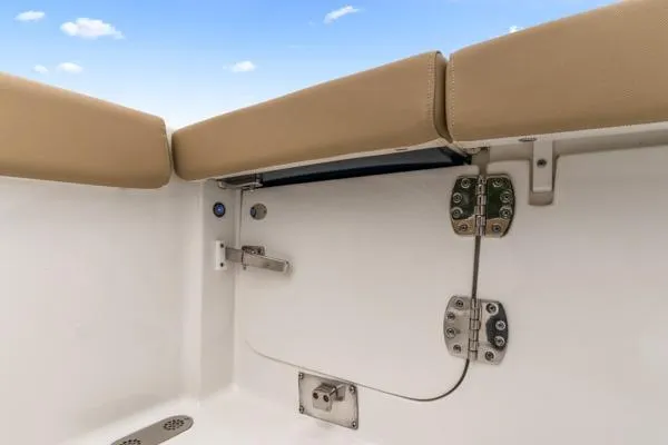 Slide: The Image of 2018 Sea Hunt Gamefish 27 boat interior with beige seating and stainless steel hardware. - 24