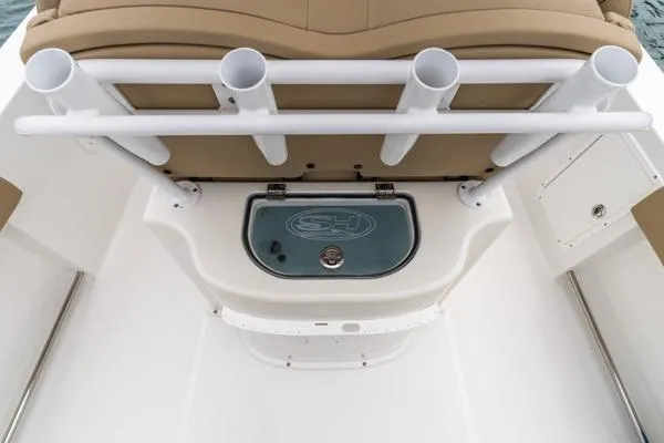 Slide: The Image of 2018 Sea Hunt Gamefish 27 boat with rod holders and storage compartment. - 25