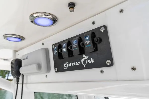 Slide: The Image of Control panel of a 2018 Sea Hunt Gamefish 27 boat with illuminated switches. - 35