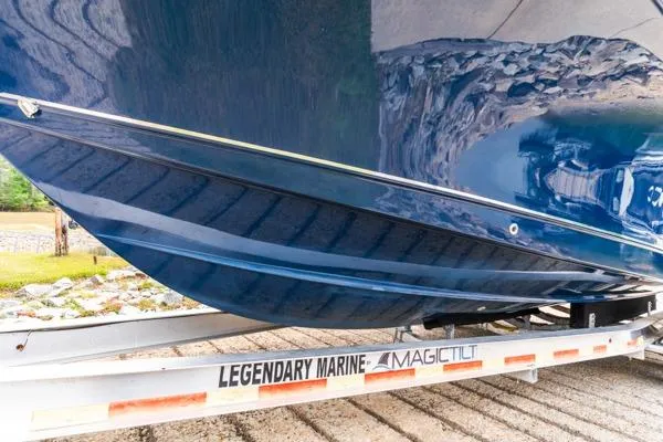 Slide: The Image of 2018 Sea Hunt Gamefish 27 boat hull on trailer, side view. - 5