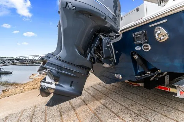 Slide: The Image of 2018 Sea Hunt Gamefish 27 boat engine at a boat ramp, ready for launch. - 7