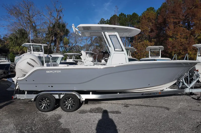 Slide: The Image of 2026 Sea Fox 248 Commander boat on trailer, side view, outdoors. - 2