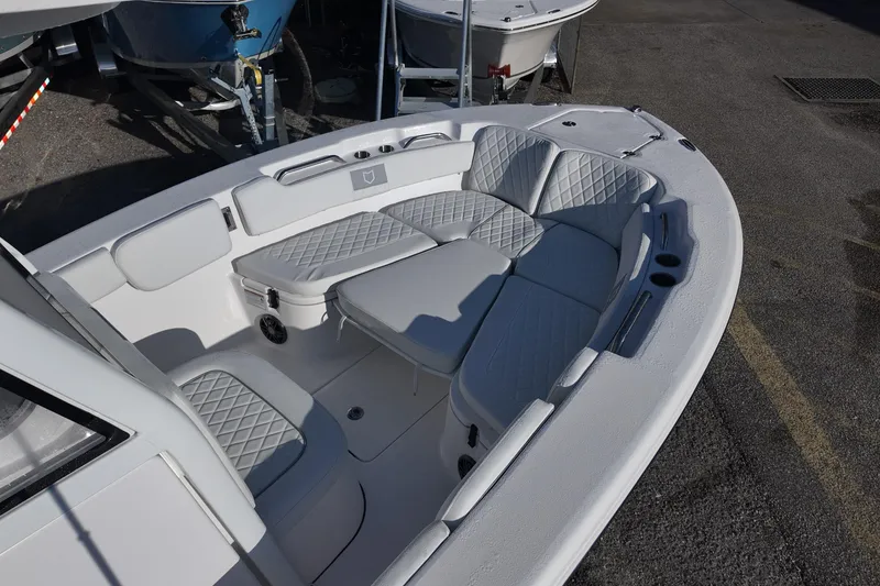 Slide: The Image of 2026 Sea Fox 248 Commander boat interior with cushioned seating and storage compartments. - 7