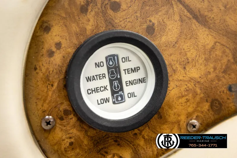 Slide: The Image of 1998 Godfrey SW2423 dashboard gauge displaying oil, water, temperature, and engine indicators. - 26