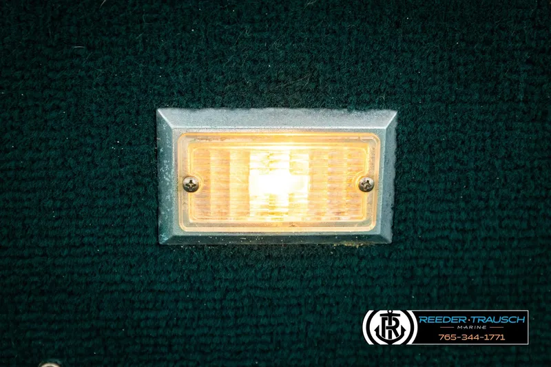 Slide: The Image of Close-up of a rectangular light fixture on a 1998 Godfrey SW2423 boat. - 32