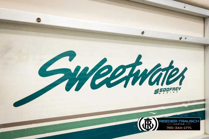 Slide: The Image of 1998 Godfrey Sweetwater SW2423 boat logo with Reeder-Trausch Marine contact details. - 39
