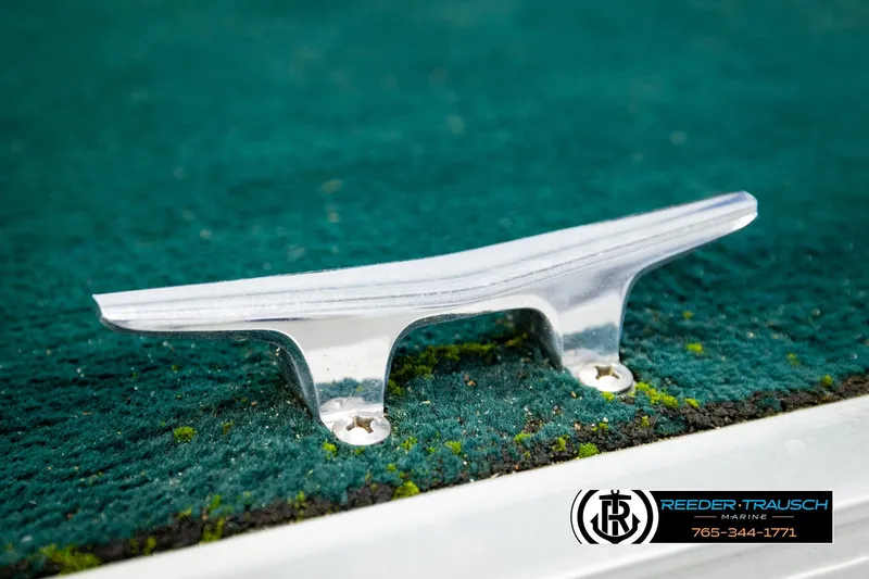 Slide: The Image of Boat cleat on green carpet, Godfrey SW2423, 1998 model, Reeder-Trausch Marine logo. - 40