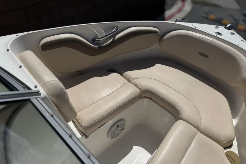 Slide: The Image of 2006 Chaparral 190 SSi boat interior with beige seating and stainless steel handle. - 13