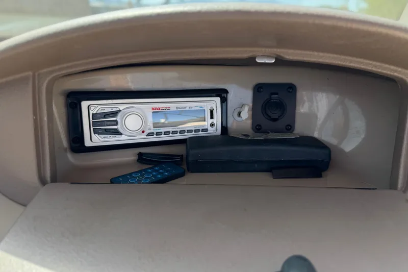 Slide: The Image of Dashboard of 2006 Chaparral 190 SSi with Boss audio system and remote control. - 21