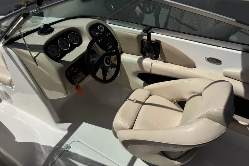 Slide: The Image of Interior of a 2006 Chaparral 190 SSi boat showing steering wheel and dashboard. - 24