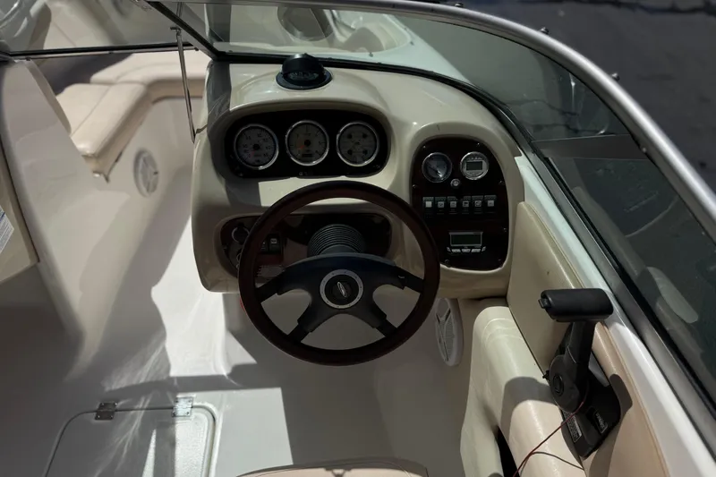 Slide: The Image of 2006 Chaparral 190 SSi boat dashboard with steering wheel and instrument panel. - 25