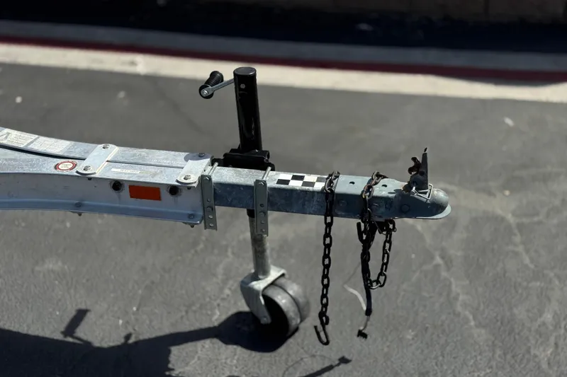 Slide: The Image of Trailer hitch of a 2006 Chaparral 190 SSi boat on pavement. - 27