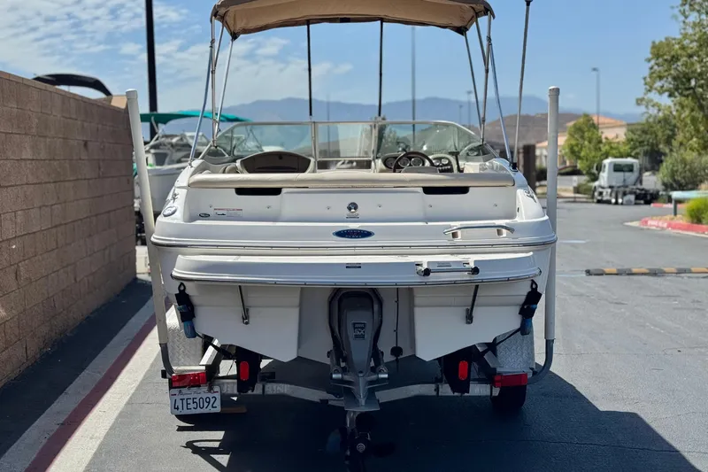 Slide: The Image of 2006 Chaparral 190 SSi boat, rear view, parked on a sunny day. - 4