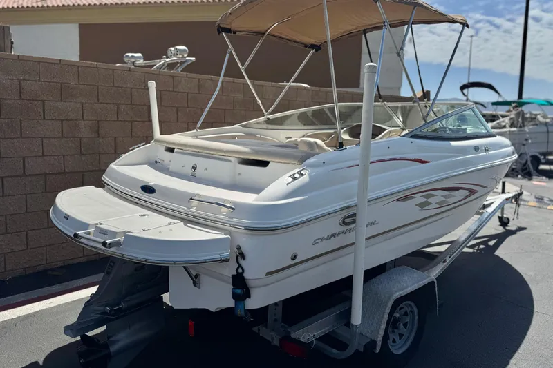 Slide: The Image of 2006 Chaparral 190 SSi boat on trailer, featuring sleek design and swim platform. - 5