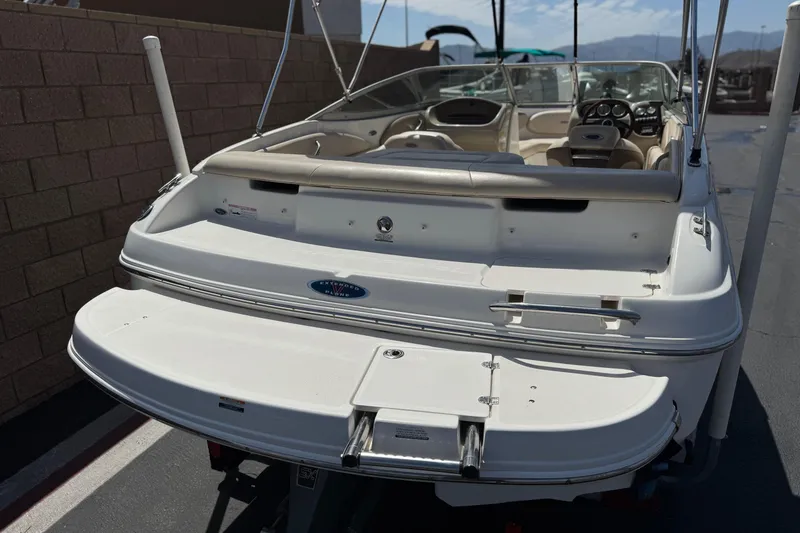 Slide: The Image of 2006 Chaparral 190 SSi boat, rear view, showcasing swim platform and seating area. - 6