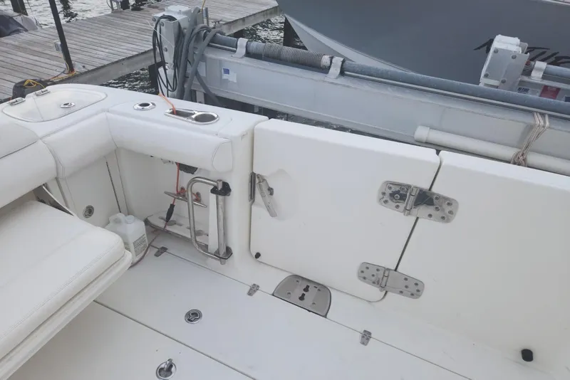 Slide: The Image of 2014 Boston Whaler 350 Outrage boat interior with seating and deck details. - 11