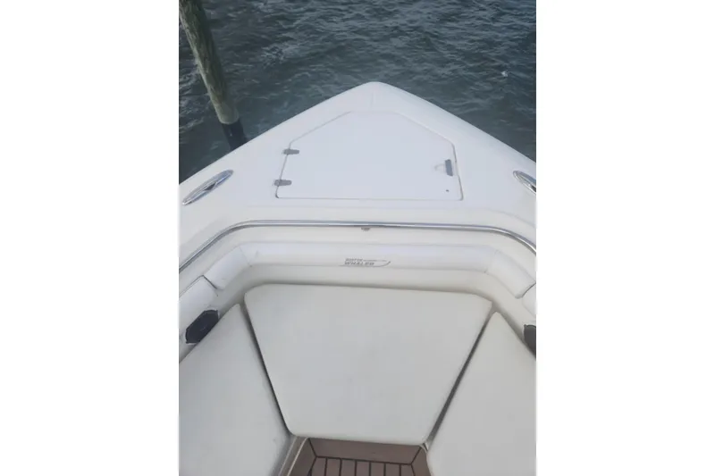 Slide: The Image of Bow view of 2014 Boston Whaler 350 Outrage, featuring sleek white seating and deck. - 21