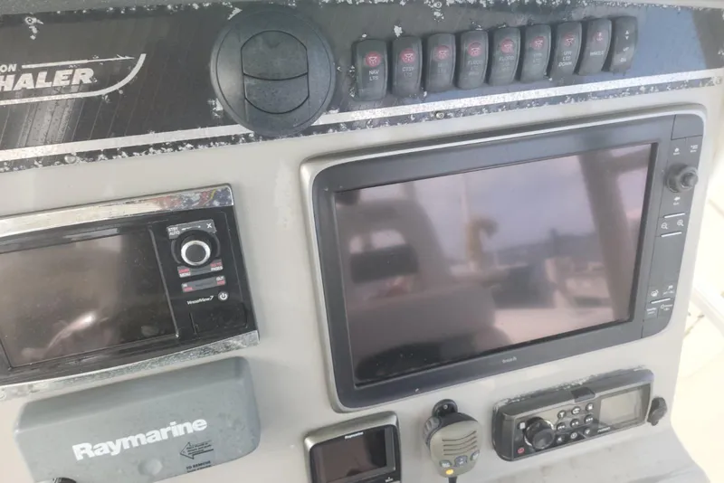 Slide: The Image of Control panel of a 2014 Boston Whaler 350 Outrage with navigation equipment. - 31