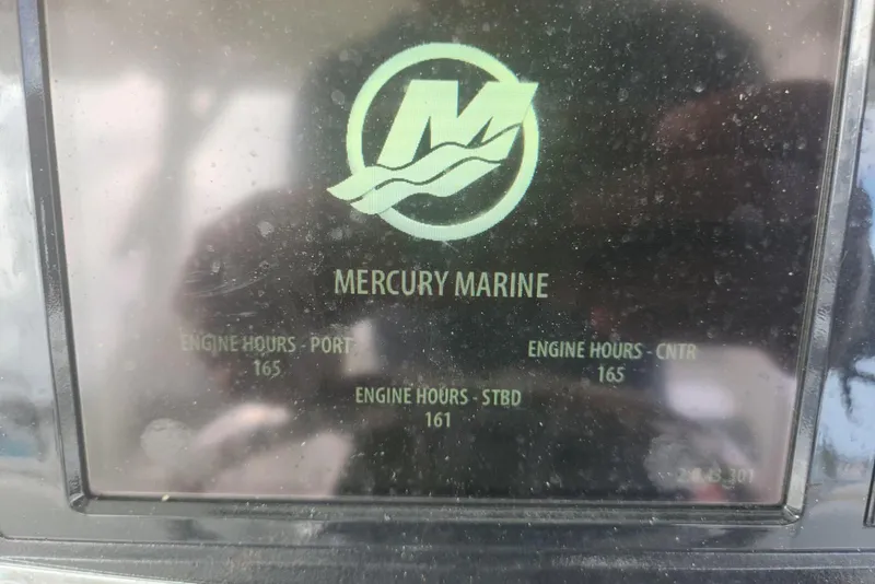 Slide: The Image of Display screen showing Mercury Marine engine hours for a 2014 Boston Whaler 350 Outrage. - 34
