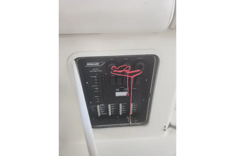 Slide: The Image of Control panel of a 2014 Boston Whaler 350 Outrage boat, featuring 12V DC distribution. - 36