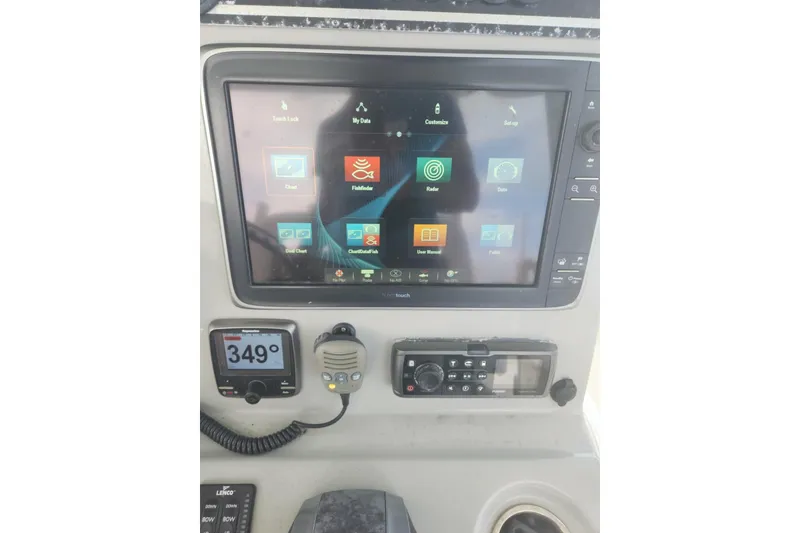 Slide: The Image of Control panel of a 2014 Boston Whaler 350 Outrage boat with navigation display. - 42
