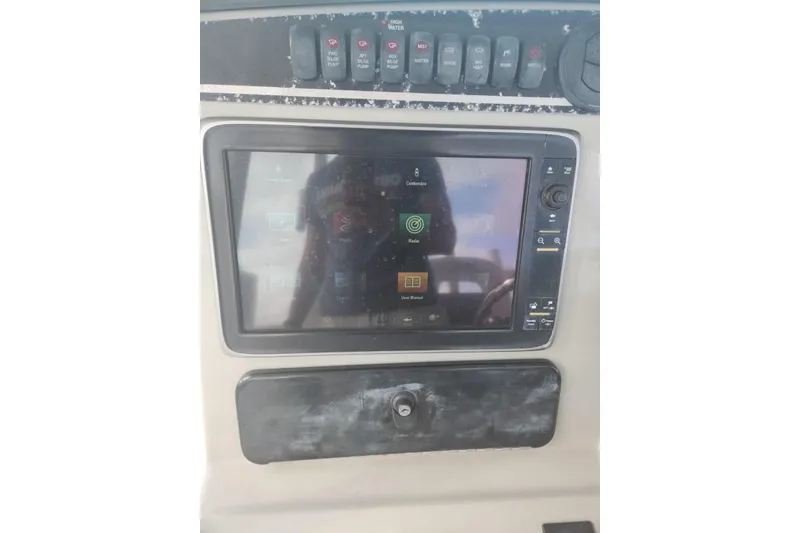 Slide: The Image of Control panel of a 2014 Boston Whaler 350 Outrage boat with touchscreen display. - 43