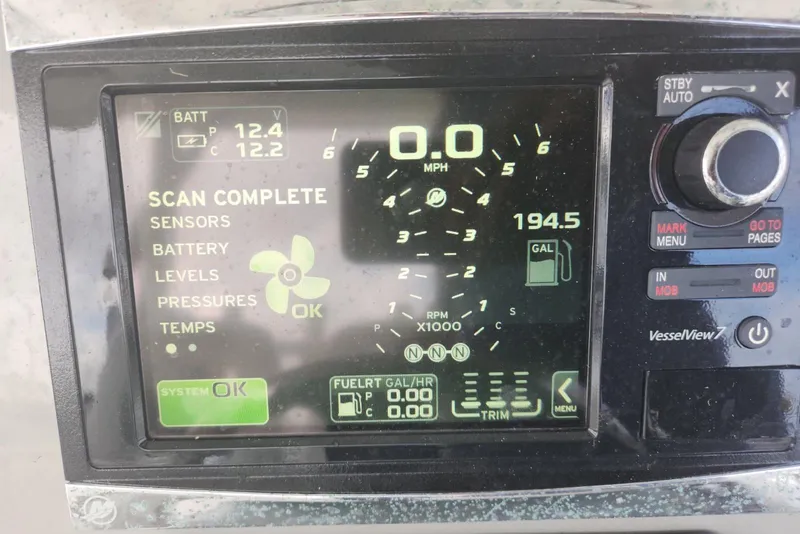 Slide: The Image of Dashboard display of a 2014 Boston Whaler 350 Outrage, showing system status and fuel levels. - 44