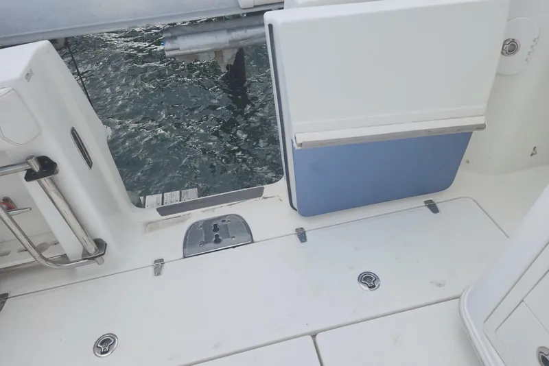 Slide: The Image of Boston Whaler 350 Outrage 2014 boat deck with open transom door. - 45