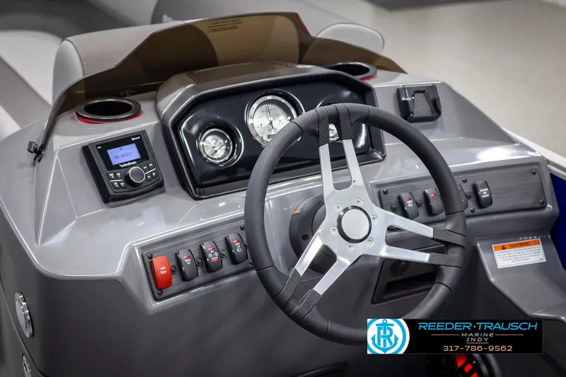 Slide: The Image of Interior view of 2025 Bennington 21 SSR helm with steering wheel and gauges. - 30