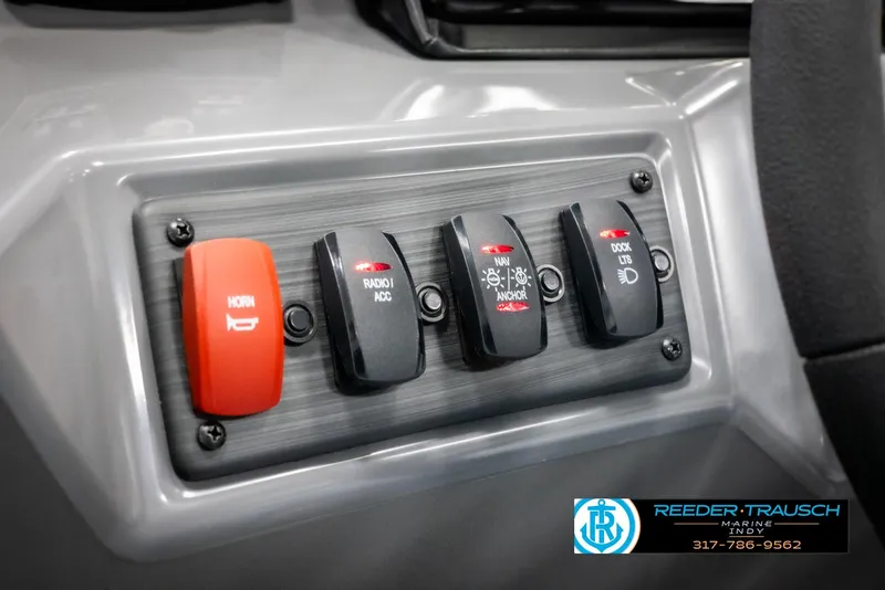 Slide: The Image of Control panel of 2025 Bennington 21 SSR with various switches. - 33