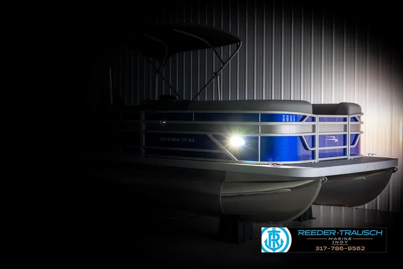 Slide: The Image of 2025 Bennington 21 SSR pontoon boat in dark setting. - 4