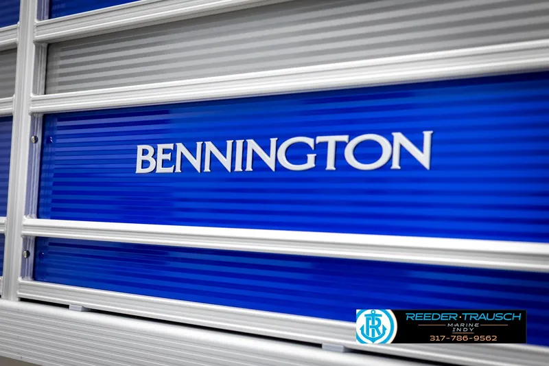 Slide: The Image of Bennington 21 SSR 2025 boat with blue design and brand logo. - 49