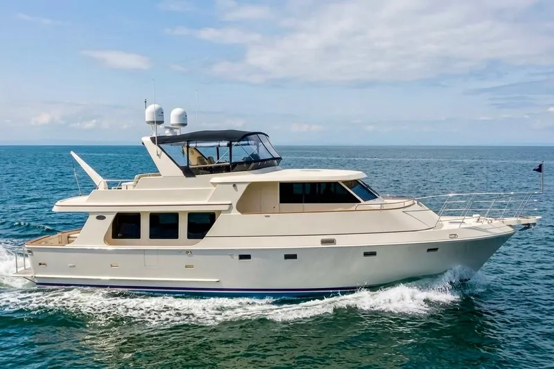 The Image of 2007 Symbol 59' Pilothouse Classic yacht cruising on open sea. - 0
