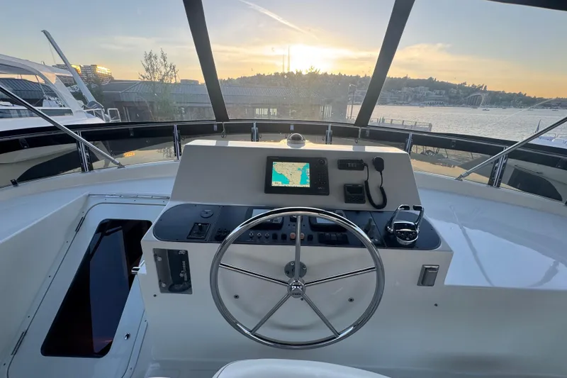 Slide: The Image of Pilothouse view of 2007 Symbol 59' Classic yacht at sunset, featuring navigation equipment. - 14