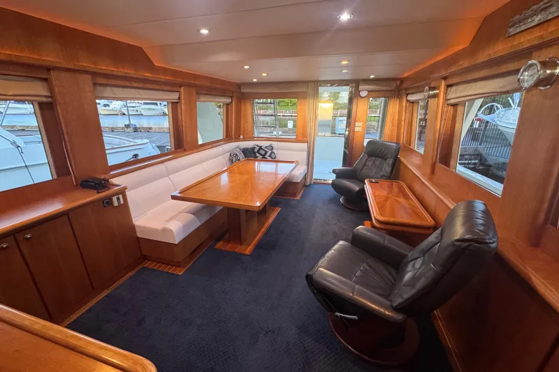 Slide: The Image of Luxurious interior of 2007 Symbol 59' Pilothouse Classic yacht with elegant seating and wood finishes. - 17