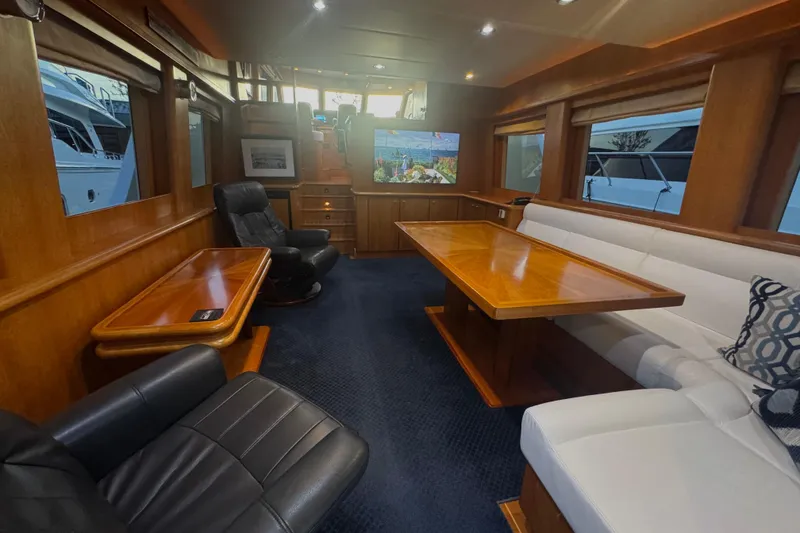 Slide: The Image of Luxurious interior of 2007 Symbol 59' Pilothouse Classic yacht with elegant seating and wooden accents. - 18