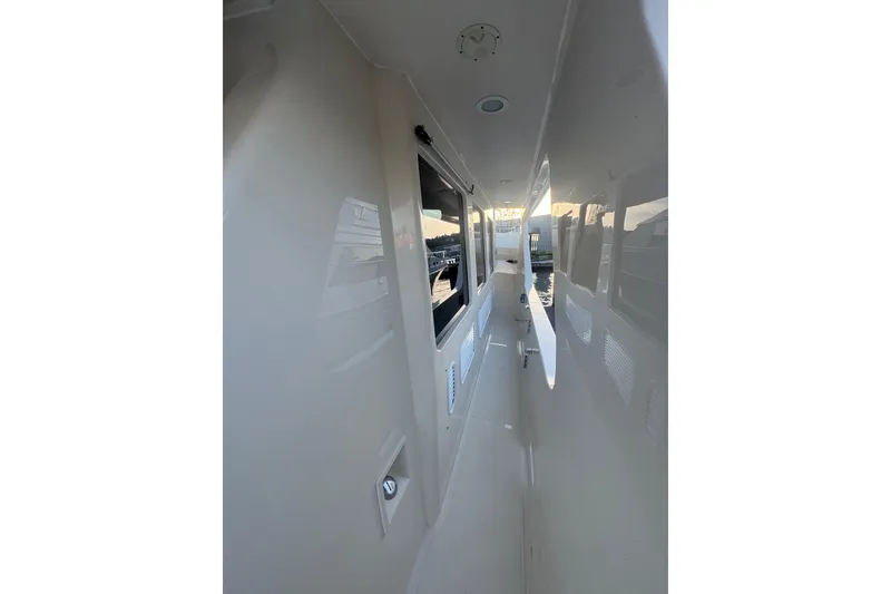 Slide: The Image of Side deck view of 2007 Symbol 59' Pilothouse Classic yacht at sunset. - 4