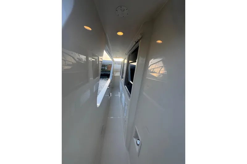 Slide: The Image of Side deck view of 2007 Symbol 59' Pilothouse Classic yacht at sunset. - 6
