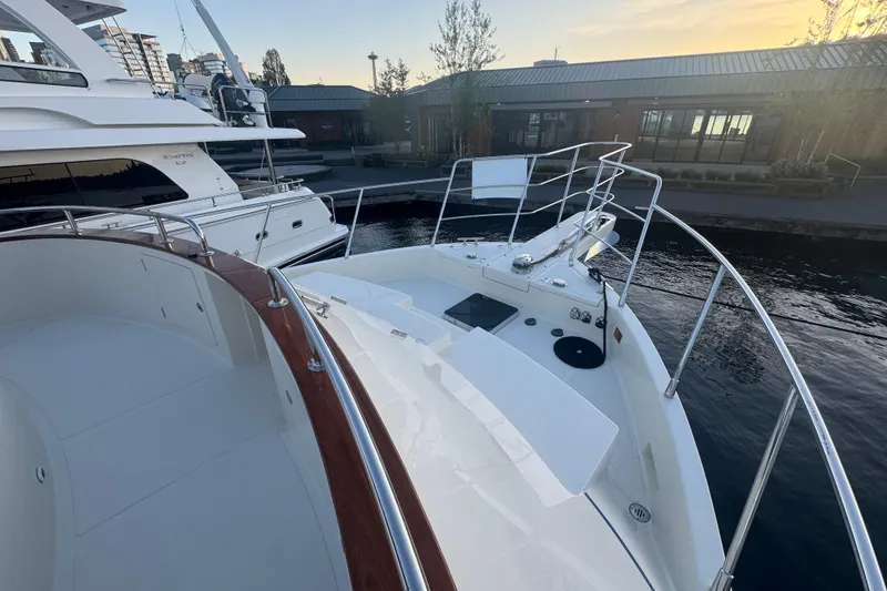 Slide: The Image of 2007 Symbol 59' Pilothouse Classic yacht docked at marina during sunset. - 8