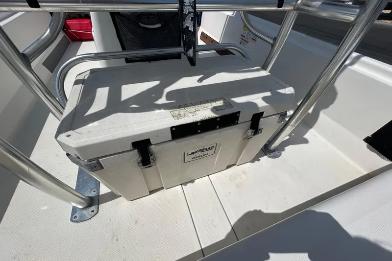 Slide: The Image of Cooler secured on 2021 Mako Pro Skiff 19 CC boat deck. - 21
